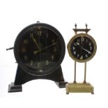 Two mystery and novelty clocks: a keyless clock with matt black dial, gold colour Arabic numerals