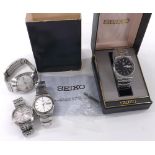 Two Seiko 5 automatic stainless steel gentlemen's bracelet watches; together with a Seiko