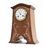 French oak Art Nouveau two train mantel clock striking on a gong, the 3.5" white dial signed