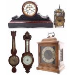 French black slate and red marble two train drumhead mantel clock striking on a bell, within a