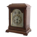 Junghans walnut three train bracket clock, the movement playing on four rods and striking the