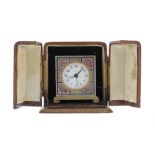 Zenith miniature alarm clock, within a square silvered case decorated with fish and stylised