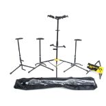 Hercules three way tripod multi guitar stand; together with a Hercules GS200B A frame guitar