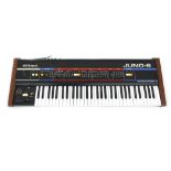 Roland Juno 6 polyphonic synthesizer keyboard, made in Japan, with X frame keyboard stand and