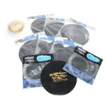 Selection of drum accessories including cymbal and stick bags. practice pads and two bongo heads