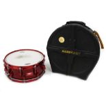 Orange County Drums 14" snare drum, red sparkle finish, within a hard case case