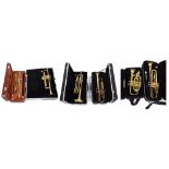 Five various brass cased trumpets, two Prelude by Bach, two by Rosetti and another by Amati