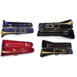 Four brass trombones by King Cleveland 605, Blessing Scholastic, King 606 and Conn Director, all