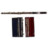Old wooden unnamed eight key flute in need of restoration; also two metal flutes by Rampone &