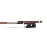 German silver mounted violin bow by and stamped Adolf G. Schuster, the stick octagonal, the ebony