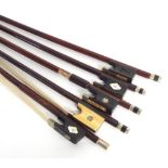 Five various German nickel mounted violin bows with fancy mother of pearl inlaid frogs (5)