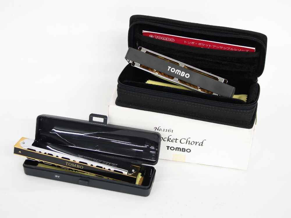 Fifteen Lee Oscar harmonicas and eight spare reed plates; Stomba Premium 21 Neo standard harmonica