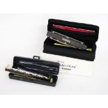 Fifteen Lee Oscar harmonicas and eight spare reed plates; Stomba Premium 21 Neo standard harmonica