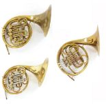Three brass French horns by Weltklang, Commonwealth and another unnamed, all cased (3)
