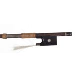 Silver mounted violin bow branded Hawkes & Sons, the stick round, the ebony frog inlaid with pearl