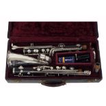 Bass Grenadilla clarinet by and stamped C.G. Conn, Elkhart, Indiana, to Low E, with 3C mouthpiece,