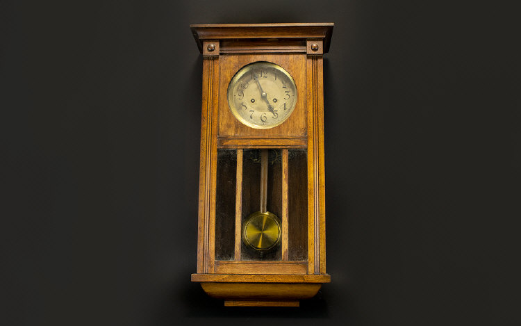 A 1930's Wall Mounted Clock In rectangul