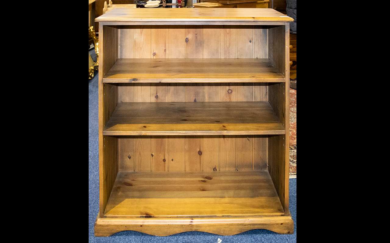 Two Pine Bookshelves comprising tall uni