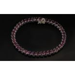 Garnet Tennis Bracelet, oval cuts of the