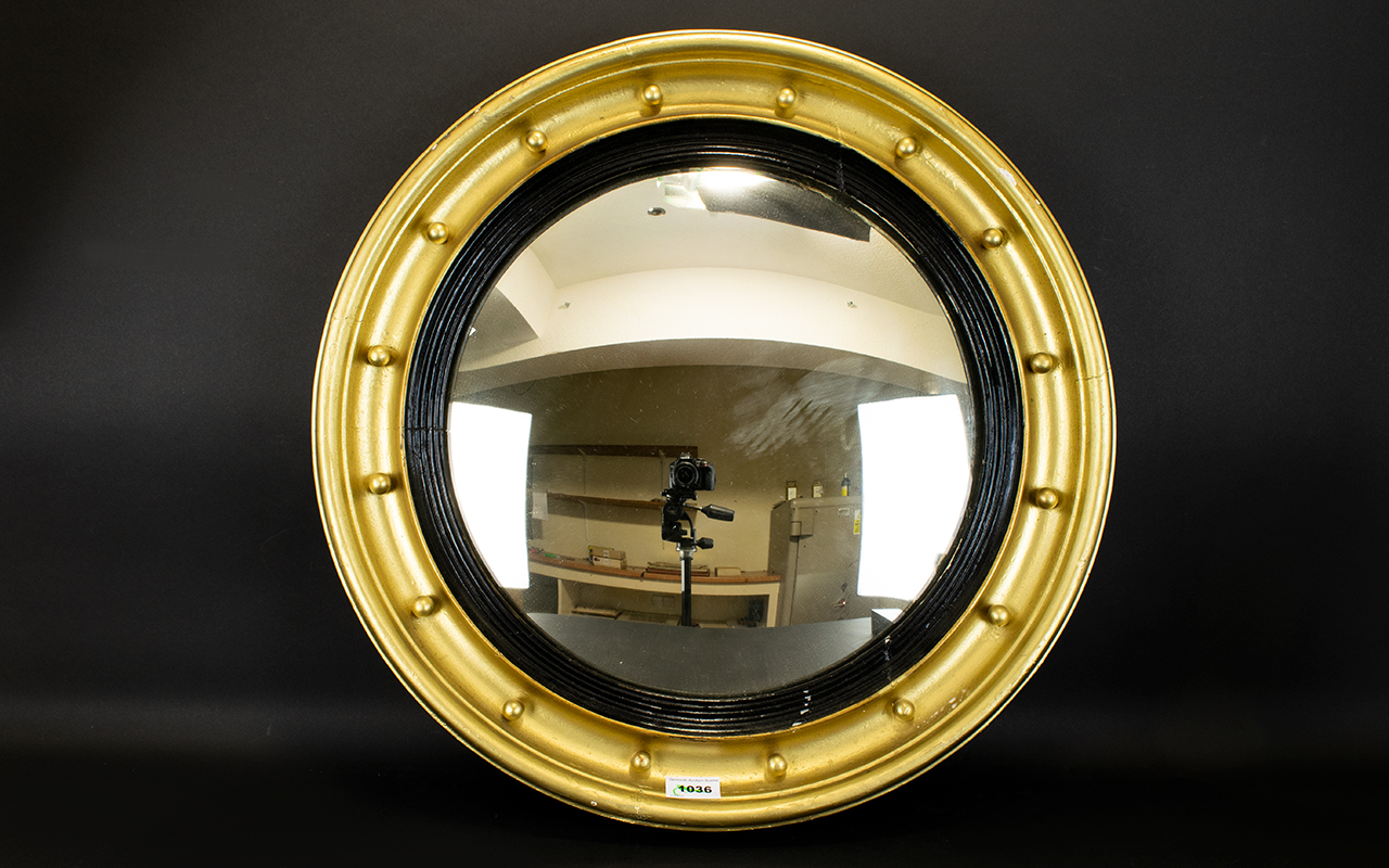 A Circular Porthole Mirror Convex mirror circa early-mid 20th century in pale gilt frame,