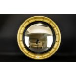 A Circular Porthole Mirror Convex mirror circa early-mid 20th century in pale gilt frame,