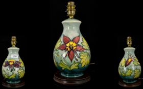 Moorcroft Columbine Pattern Table Lamp Boxed. height 11 inches, raised on circular wooden base.