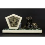 Art Deco Marble Figural Mantle Clock Raised on rectangular base of cream and moss green veined Verdi