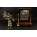 A Walnut Toilette Mirror of typical form, swivel top, shaped base.