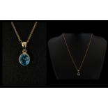 A Faceted Blue Topaz 9ct Gold Set Pendant The bale marked for 9ct gold,