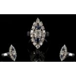 18ct Diamond Cluster Ring, Marquise Shaped Mount Set With A Central Cushion Cut Diamond Between