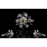 18ct White Gold Diamond & Sapphire Cluster Ring, Central Diamond Surrounded By 6 Further Round Cut