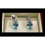 18ct White Gold Aquamarine And Diamond Drop Earrings The central oval cut stones of beautiful clear