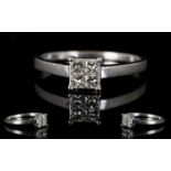 18ct White Gold Contemporary Diamond Set Dress Ring the four square cut diamonds of good colour