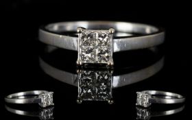 18ct White Gold Contemporary Diamond Set Dress Ring the four square cut diamonds of good colour