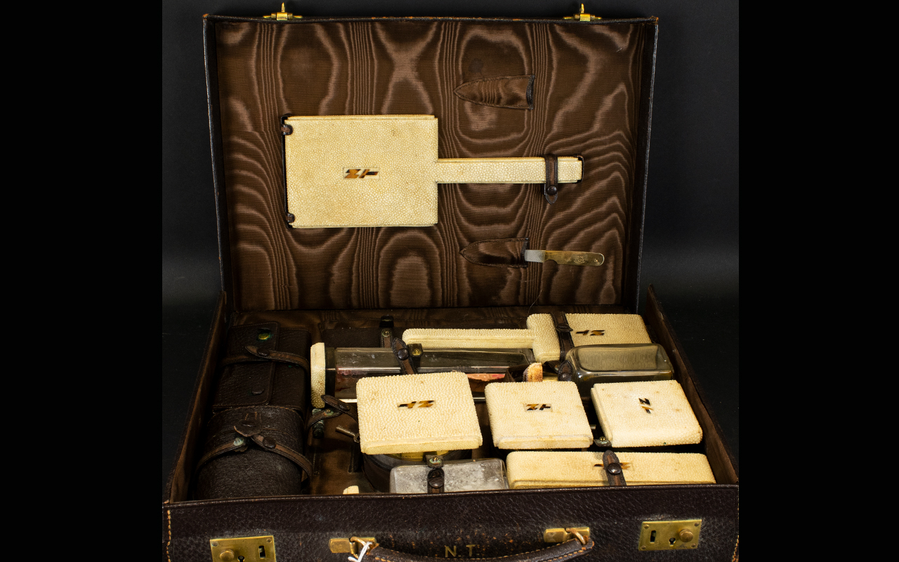 Art Deco Twelve Piece Travelling Vanity Set Each with gilt silver collars,