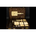 Art Deco Twelve Piece Travelling Vanity Set Each with gilt silver collars,