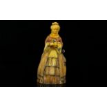 Cold Painted Novelty Lighter In the form of a crinoline lady with lapdog.