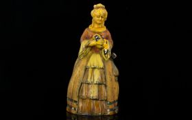 Cold Painted Novelty Lighter In the form of a crinoline lady with lapdog.