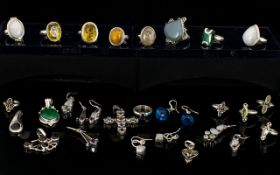 A Mixed Collection Of Gemset Rings Earrings And Pendants A varied collection to include moonstone