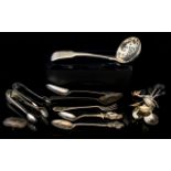 A Mixed Collection Of Silver Flatware To include 1824 sifter, set of six coffee bean spoons,