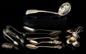 A Mixed Collection Of Silver Flatware To include 1824 sifter, set of six coffee bean spoons,