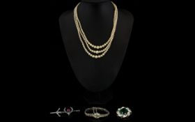 A Small Quantity Of Costume Jewellery Five items in total to include three strand faux pearl