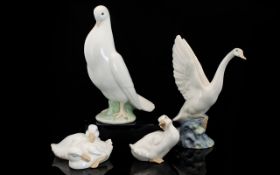 A Collection Of Nao Bird Figures To include standing dove, swan with outstretched wings, and two