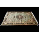 A Large Woven Silk Carpet Keshan rug with Eau De Nil ground and traditional Middle Eastern floral