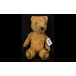 A Vintage Jointed Teddybear Circa 1920's fully jointed, stuffed with straw,