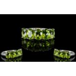 Peridot Five Stone Band Ring, five oval cut peridots totalling 4cts,