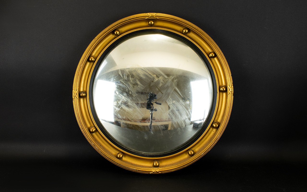 A Circular Porthole Mirror Convex mirror circa 1950's in yellow gilt frame, diameter 17 inches.