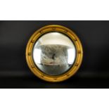 A Circular Porthole Mirror Convex mirror circa 1950's in yellow gilt frame, diameter 17 inches.