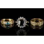 Three 9ct Gold Dress Rings Comprising blue topaz and diamond chip, full eternity and a cluster ring.