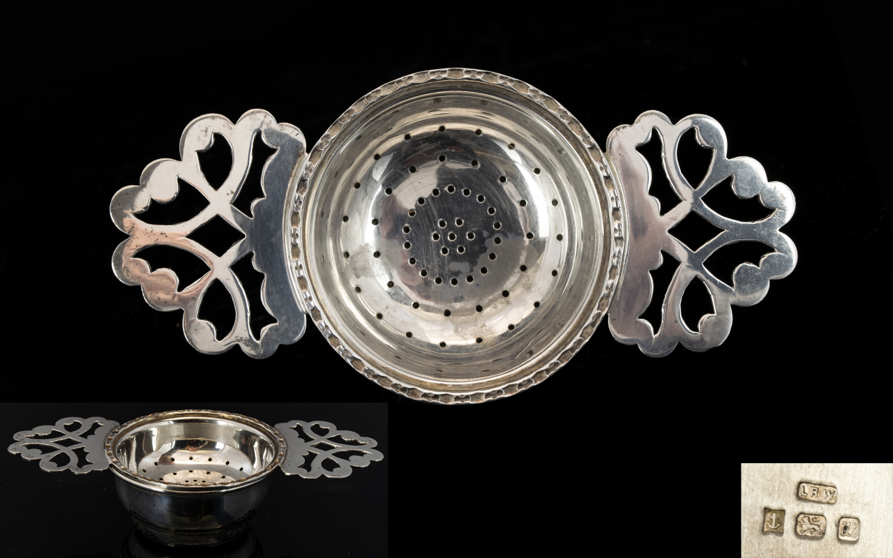 Elizabeth II - Solid Silver Tea Strainer with Drip Bowl. The Tea Strainer with Filigree Handles.